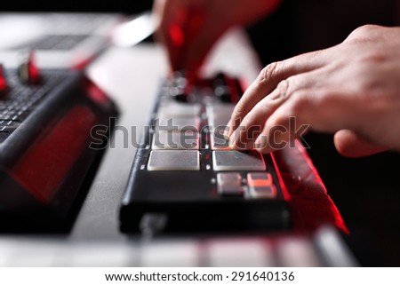 Sound system. Hands DJ mixing music at the club during the event