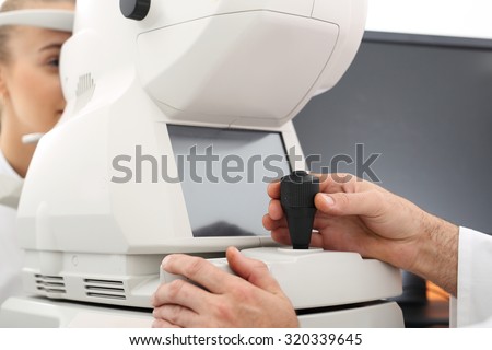 Ophthalmologist, eye test computer. The patient in ophthalmology clinic during the study of computer vision defects