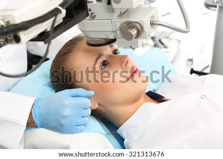 Laser vision correction. A patient in the operating room during ophthalmic surgery