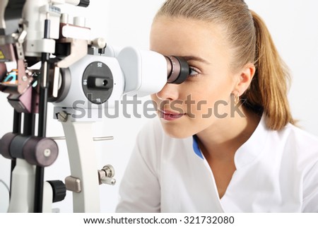 Computer aided visual acuity.\
The patient during an eye examination at the eye clinic