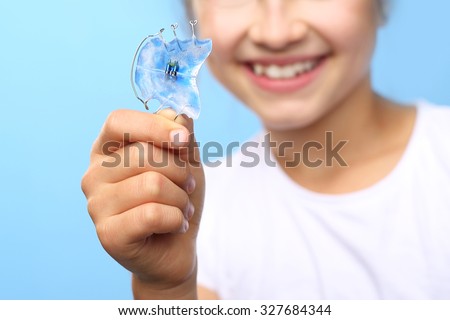 Dental braces.Child with orthodontic appliance.Portrait of a little girl with orthodontic appliance .