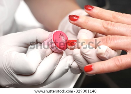 Manicure, patterned nails panther . Beauty salon, manicure, woman to a beautician for manicure