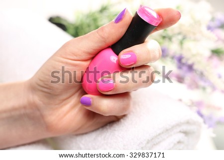 Pastel nails, purple nail polish.Colored manicure, cosmetic colored lacquer painting nails