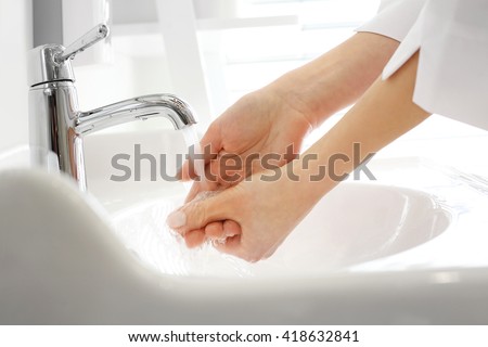 Doctor washes his hands.A doctor washes his hands, disinfect hands before surgery