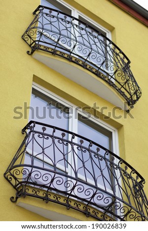 detail of building and decorative metal railing window