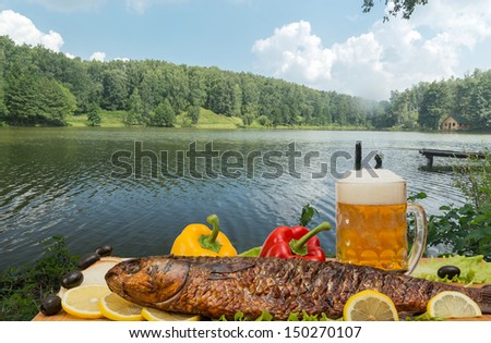 Products for a picnic on the lake background