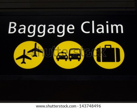 Airport baggage sign directing passengers to various areas of the airport