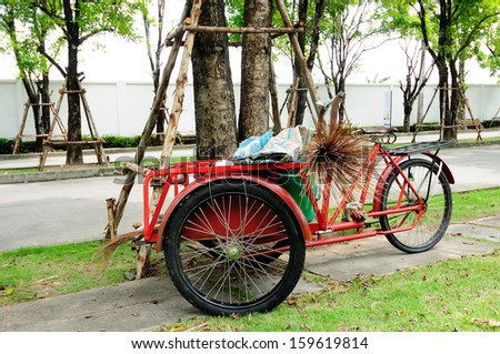 Red trolley for cleaning park and tree