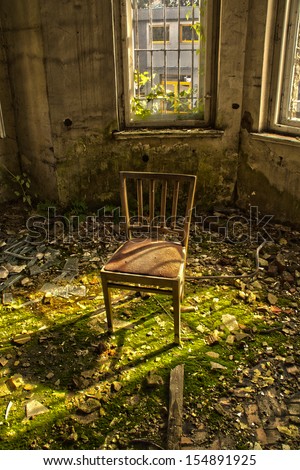 Old chair in an abandoned dilapidated house