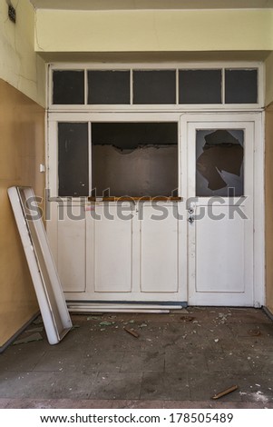 Damaged door in an abandoned hospital