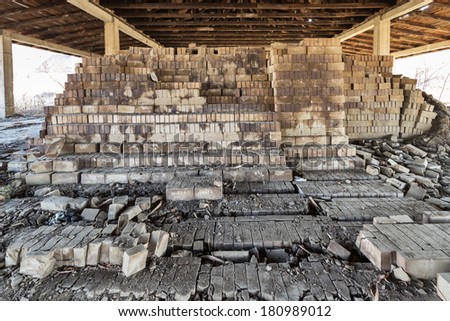 stack of bricks in an abandoned brick factory and destroyed