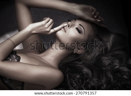 Beauty portrait of sensual elegant woman. Girl with long curly hair.