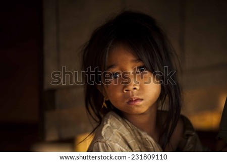 SEKONG, LAOS, APRIL 13 : An unidentified Laos little girl in the village of Sekong, Laos, on April 13, 2014