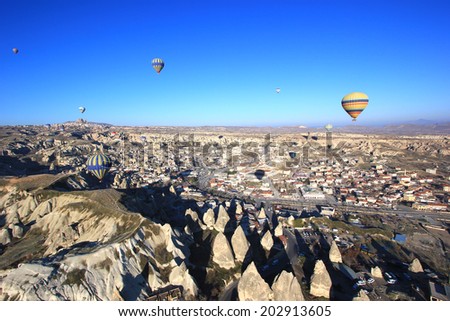 CAPPADOCIA, TURKEY - Mar 5,2014: Cappadocia landscape view and hot air balloon. Hot air balloon is one of the most famous activity that journey have to do in Cappadocia.