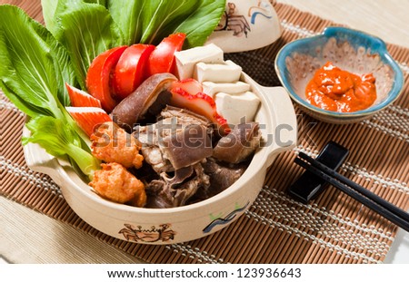this is a chinese food, so many food like vegetable, meat and fruit etc, put them in a pot.