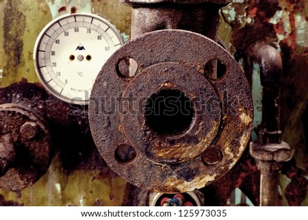 old rusty industrial tap water pipe and valve