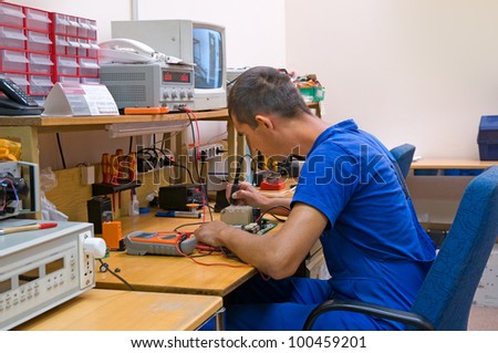 The electrician is engaged in repair of an electric equipment