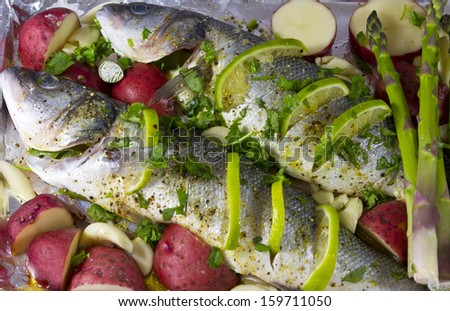 marinated fish with green asparagus, potato, lemon