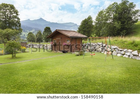 Switzerland. House in mountains Alps.