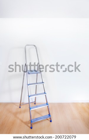 Aluminum ladder in interior room