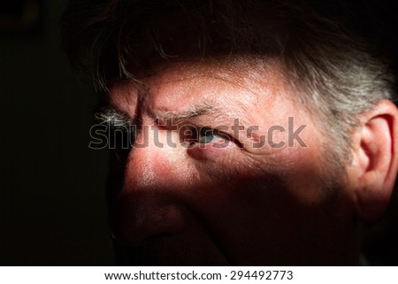 Senior man in shadow