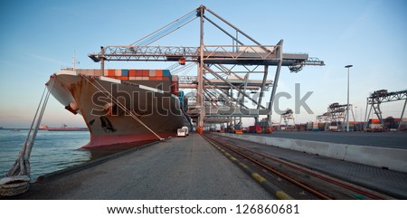 Moored container ship and gantry cranes