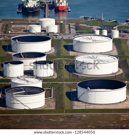Oil drums in a harbor