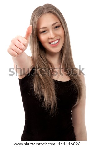 Portrait of attractive young female student showing a thumbs up