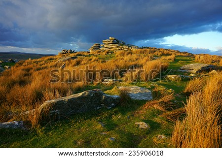 Sunset over the Cheesewring, Bodmin Moor Cornwall UK, this granite tor is a natural weathered formation and is about 7 metres high, December 2014