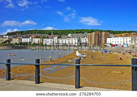 Holiday makers enjoying a beautiful summer day on the sandy beach at Weston Super Mare, Somerset, United Kingdom