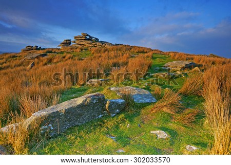 Sunset over the Cheesewring, Bodmin Moor, Cornwall, United kingdom, this granite tor is a natural weathered formation and is about 7 metres high.