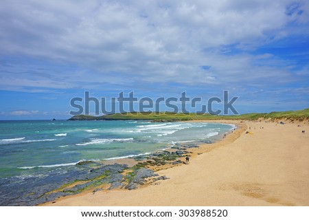Constantine Bay and beach, looking towards Booby\'s Bay and Trevose Head, showing holiday makers enjoying a beautiful day, near Padstow on the Atlantic coast of Cornwall, United Kingdom