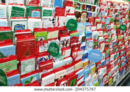 TORONTO, CANADA - NOVEMBER 30, 2013: Greeting cards on display in a store. Hallmark Cards and American Greetings are the largest producers of greeting cards in the world.