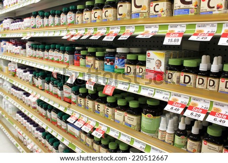 TORONTO, CANADA - MAY 07, 2014: Different types of vitamins and supplements on shelves in a pharmacy. According to studies, North America and Asia lead vitamin and supplement usage in the world.