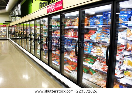 TORONTO, CANADA - MAY 06, 2014: Frozen foods aisle in a supermarket. In North America, consumption of frozen food has increased in recent years, mostly due to people\'s busy lifestyle.