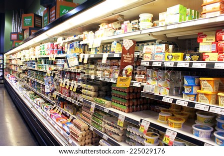 TORONTO, CANADA - SEPTEMBER 13, 2014: Eggs and dairy products on shelves in a supermarket. Egg and dairy are the main sources of protein and calcium.