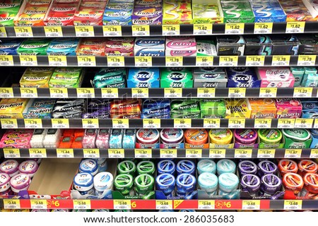 TORONTO, CANADA - OCTOBER 31, 2014: Variety of chewing gums in a supermarket. Wrigley, the manufacturer of Excel and Orbit gums, accounts for 60% market share of the worldwide chewing gum market.