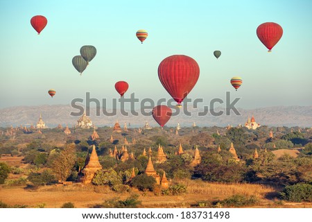 Multicolored hot air balloons over Buddhist temples at sunrise Bagan MyanmarCanon 5D Mk II Multicolored hot air balloons over Buddhist temples at sunrise Bagan MyanmarCanon 5D Mk II
