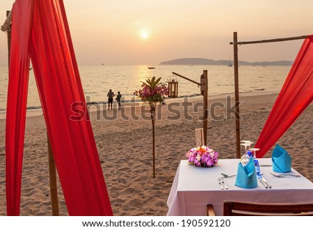 Romantic evening table for two persons on the beach at sunset. Canon 5D Mk II.