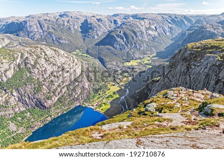 Tourism and recreation. Group of hikers trekking in Rogaland mountains, Norway. Canon 5D.