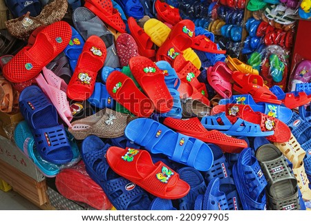 CHONGQING, CHINA - SEPTEMBER 2, 2014: colored shoes of Chinese production at a local store of Chongqing, China on September 2, 2014. China is a major producer and exporter of footwear in the world.