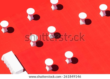 White banquet tables on red outdoor