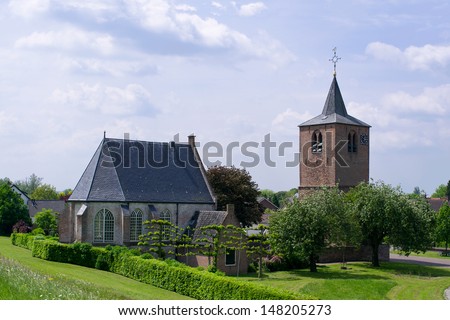 Reformed Church in Gendt, a small an old medieval church. There remains only a chapel. The nave no longer exists. The tower stands apart. The church is situated near the riverdike.