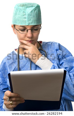 Doctor woman is studying a health chart and looks worried.