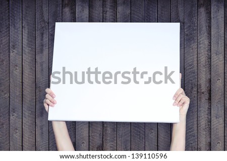 Holding Banner on Wood Background