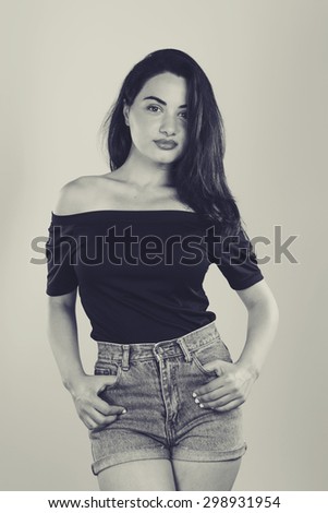 Woman in jeans short in studio