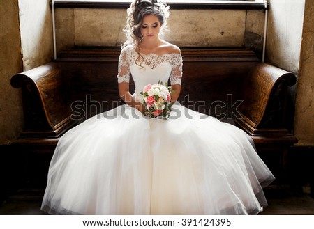 bride with bouquet in hand