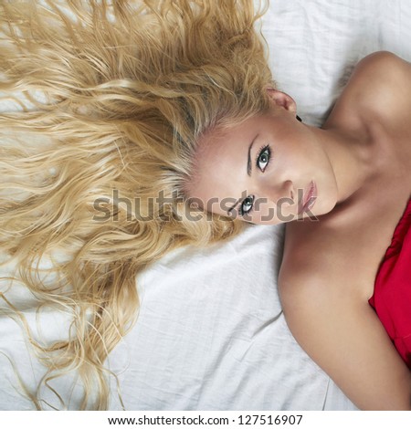beautiful blond woman on the bed