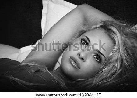 Beautiful blond woman on the bed