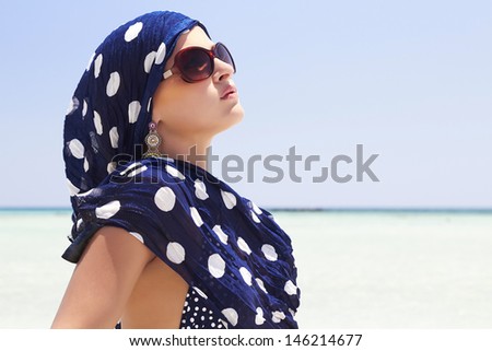beautiful woman on beach. arabian style. your text here